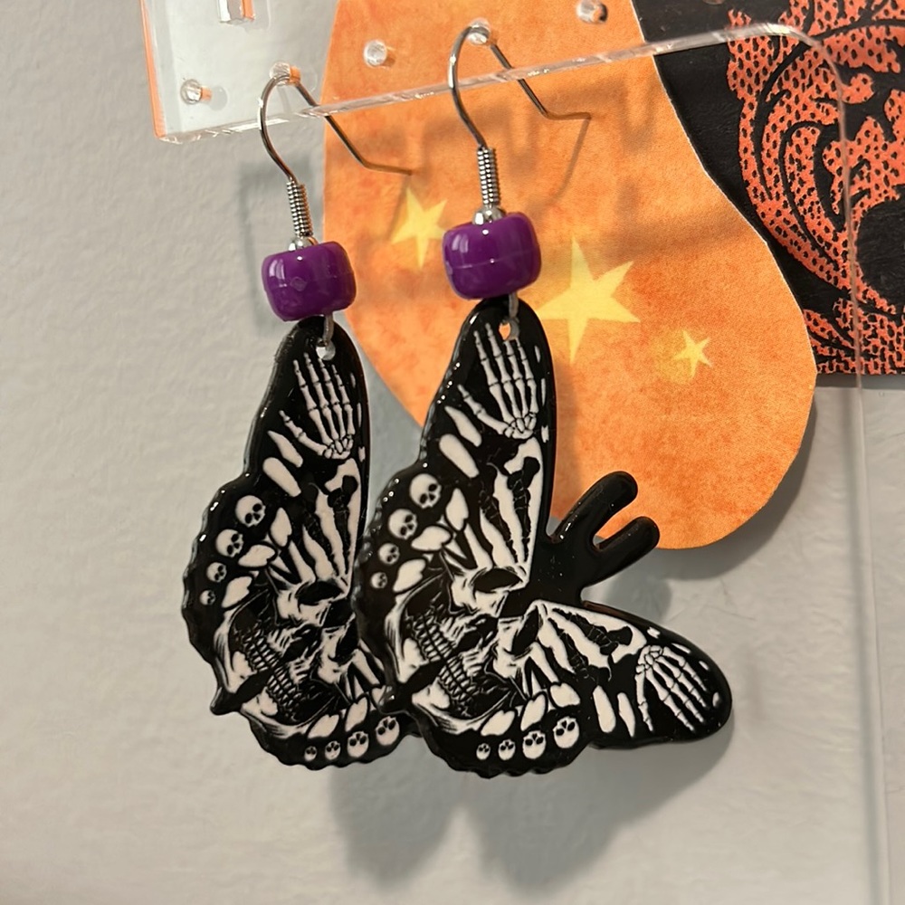 Homemade skeleton butterfly earrings